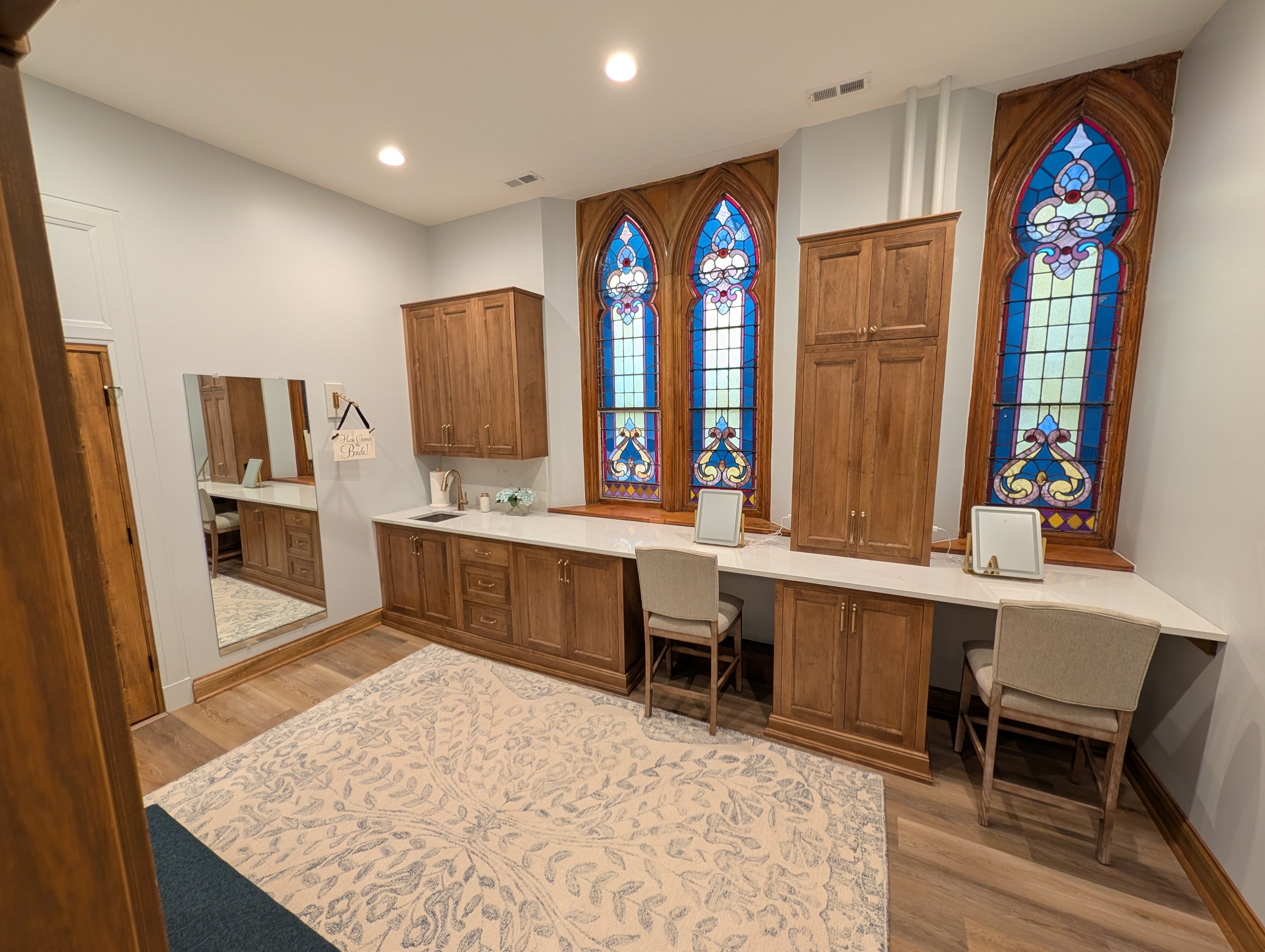 Private bride's preparation room with stained-glass windows