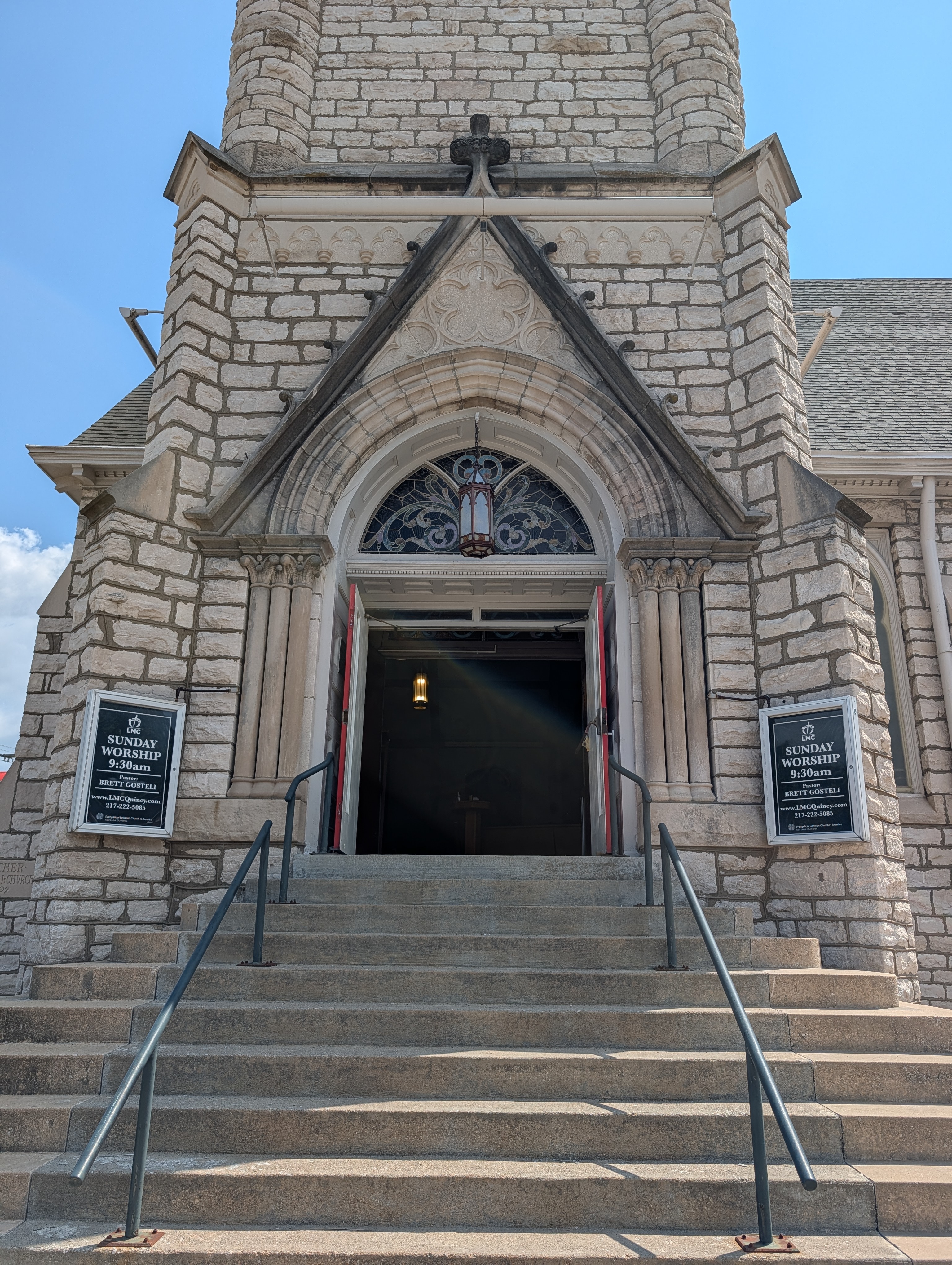 Open front doors and stone entrance